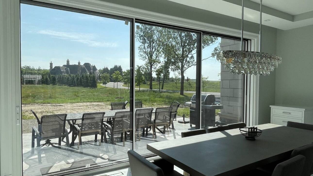 Spacious dining area with sleek sliding glass door opening to patio – RD Sales patio doors in Kitchener-Waterloo