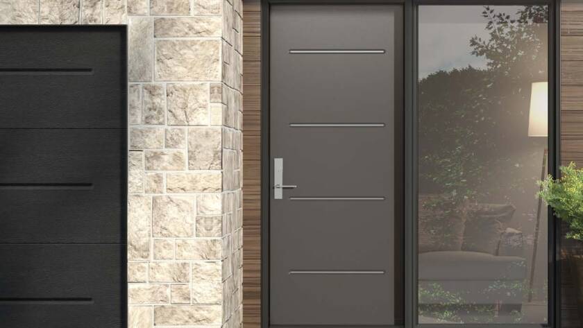 Sleek steel entry door with horizontal accents and side glass panel on a modern home in Kitchener