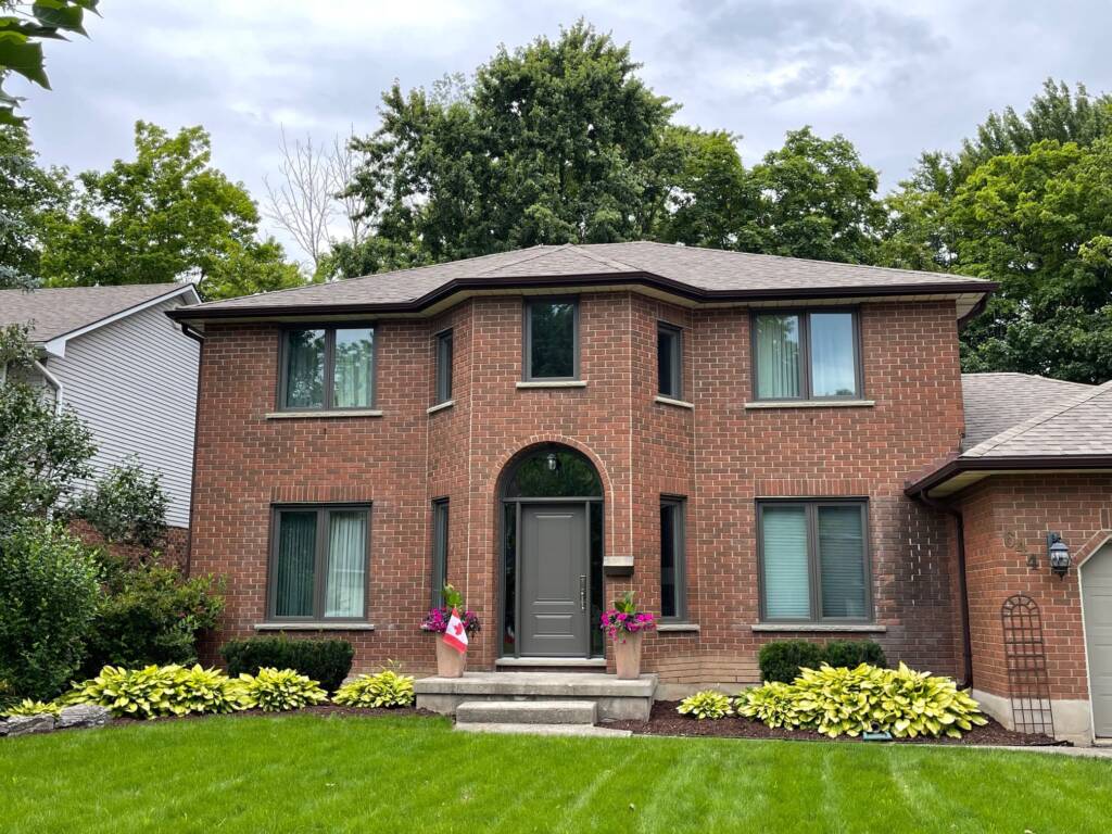 Traditional brick house in Waterloo with upgraded windows, showcasing timeless style