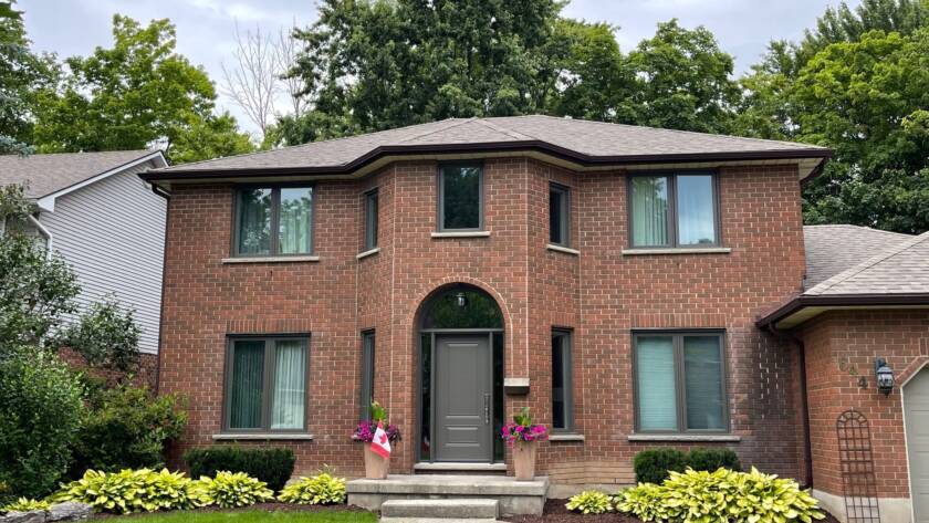 Traditional brick house in Waterloo with upgraded windows, showcasing timeless style